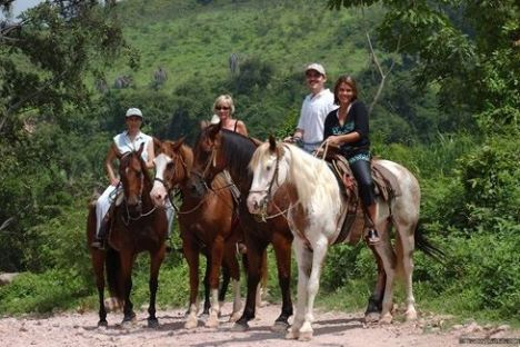 a group of people riding on the back of horses