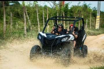 a man flying through the air while riding a bike down a dirt road